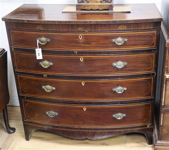 A George IV inlaid satinwood banded mahogany bow front chest W.100cm